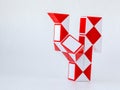 red and white bicolor magic snake Transformable twist puzzle in shape of cock isolated Royalty Free Stock Photo