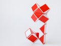 red and white bicolor magic snake Transformable twist puzzle in shape of flower Royalty Free Stock Photo
