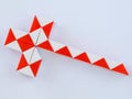 red white bicolor magic snake Transformable twist puzzle in shape of knight sword Royalty Free Stock Photo