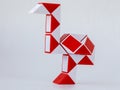 red and white bicolor magic snake Transformable twist puzzle in shape of ostrich isolated Royalty Free Stock Photo