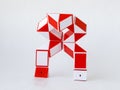 red and white bicolor magic snake twist puzzle in shape of robot transformer Royalty Free Stock Photo