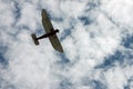 Red and White Biplane in a Blue and White Sky Royalty Free Stock Photo