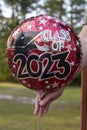 Red white and black class of 2023 graduation balloon