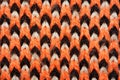 Red, white and black synthetic knitted fabric texture Royalty Free Stock Photo