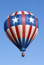 Red , white and blue balloon over a beautiful Florida sky