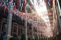 Red, white and blue banners hang from porches, waving in the breeze like colorful flags. Star shaped confetti and streamers line Royalty Free Stock Photo