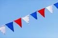 Red, white and blue flags on a blue sky background Royalty Free Stock Photo
