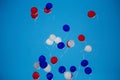 Red, white, blue helium balloons are flying into the blue sky Royalty Free Stock Photo