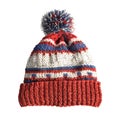 Red, White, and Blue Knitted Beanie with Pom Pom Royalty Free Stock Photo