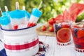 Red-white-and-blue popsicles on an outdoor table