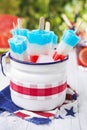 Red-white-and-blue popsicles on an outdoor table Royalty Free Stock Photo