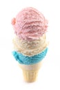 Red White and Blue Scoops of Ice Cream on a Cone on a White Background Royalty Free Stock Photo