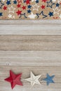 Red, White And Blue Stars Burlap Ribbon On Weathered Wood Background
