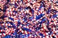 Red white and blue stars and stripes tinsel - selective focus on front with blurred bokeh - festive patriotic background Royalty Free Stock Photo