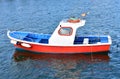Red white and blue traditional wooden galician fishing boat moored in a harbor. Galicia, Spain. Royalty Free Stock Photo