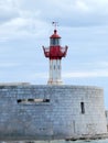 Red and white breakwater lighthouse Royalty Free Stock Photo