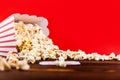 Red and White Bucket Of Popcorn With Two Red Movie Tickets Royalty Free Stock Photo