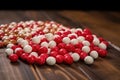 red and white candies on a wooden table