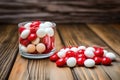 red and white candies on a wooden table