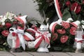 Red and white candles and flowers in the colors of the Polish flag, national anniversary in Poland. Polish national colors