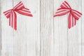 Red and white candy cane bow Christmas background with weathered wood Royalty Free Stock Photo