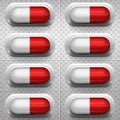 Red and white capsule pills with background