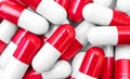 Red-white capsules as medical background Royalty Free Stock Photo