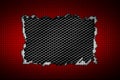 Red and white carbon fiber tear on the black metallic mesh. Royalty Free Stock Photo