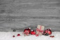 Red white checked christmas presents on old grey wooden backgrou Royalty Free Stock Photo
