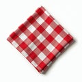 Red and white checked fabric napkin, isolated on white background. Full depth of field showcases classic gingham pattern. Perfect Royalty Free Stock Photo