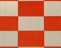 Red and white checkered pattern on a metal wall, architecture background Royalty Free Stock Photo