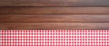 Red white checkered picnic tablecloth on wooden table, banner, copy space. 3d illustration Royalty Free Stock Photo