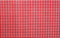 Red and white checkered tablecloth. Top view table cloth texture background. Red gingham pattern fabric. Picnic blanket texture. Royalty Free Stock Photo