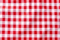 Red and white checkered tablecloth. Top view table cloth texture background. Red gingham pattern fabric. Picnic blanket texture. Royalty Free Stock Photo