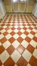 Red and white chess tile floor pattern. Close-up. Royalty Free Stock Photo