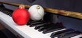 Christmas balls on piano keyboard Royalty Free Stock Photo