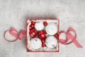 Red and white Christmas baubles in a box Royalty Free Stock Photo