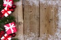 Red and white Christmas gift side border on wood Royalty Free Stock Photo