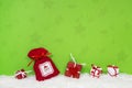 Red and white christmas gifts on green background. Royalty Free Stock Photo