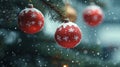 Red and white Christmas ornaments adorned with snowflake patterns, hanging gracefully from a tree against a backdrop of falling Royalty Free Stock Photo