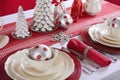 Red and White Christmas Table Setting. Royalty Free Stock Photo