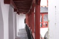 Red and white colonnade of a medieval balcony