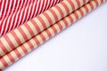 Red and white and craft guft wrapping paper rolls in white background with copy space .