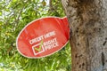 A Credit Here Sign On Mango Tree Trunk