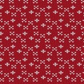 Red and white cross sign and diamond shape knitting pattern back Royalty Free Stock Photo