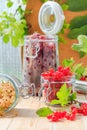 Red white currants gooseberries jars preparations Royalty Free Stock Photo