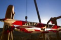 Red and white danger tag tape sign on exclusion zone taping off working area dropped object crane lifting high risk work Royalty Free Stock Photo