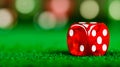 A red dice sitting on top of a green table Royalty Free Stock Photo