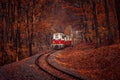 Red and white diesel train coming. Royalty Free Stock Photo