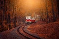 Red and white diesel train coming. Royalty Free Stock Photo